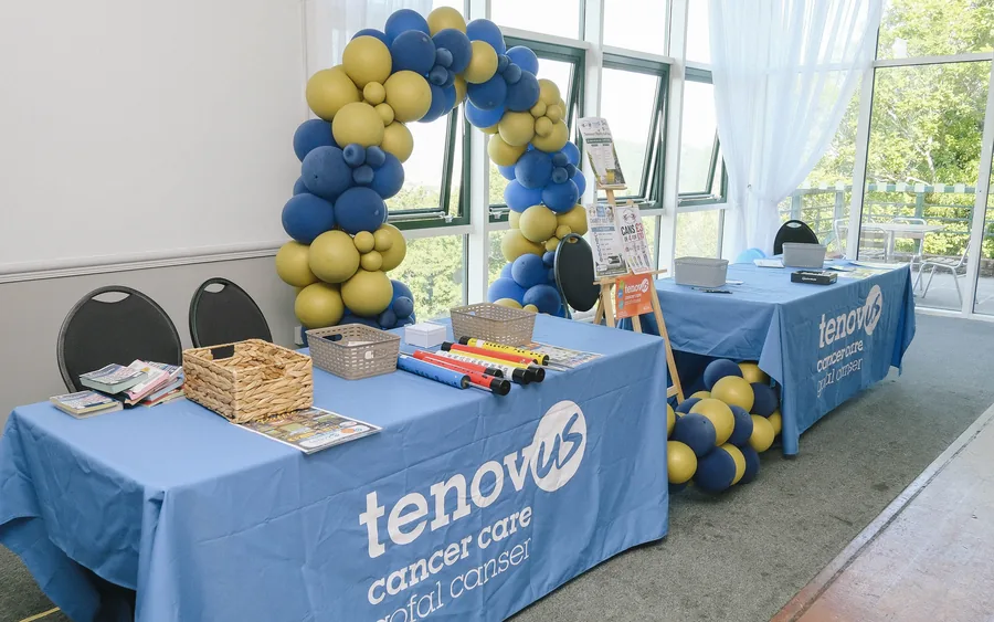 A charity partner&rsquo;s stand set up in the function room on a club charity day